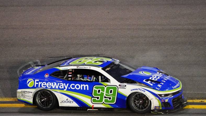 Feb 19, 2024; Daytona Beach, Florida, USA; NASCAR Cup Series driver Daniel Suarez (99) wrecks during the Daytona 500 at Daytona International Speedway. Mandatory Credit: John David Mercer-USA TODAY Sports