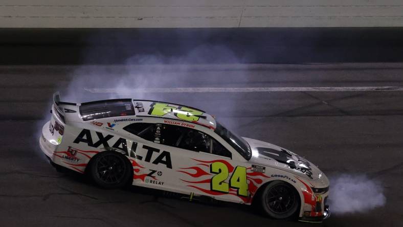 Feb 19, 2024; Daytona Beach, Florida, USA; NASCAR Cup Series driver William Byron (24) does a burn out after winning the Daytona 500 at Daytona International Speedway.  Mandatory Credit: Peter Casey-USA TODAY Sports