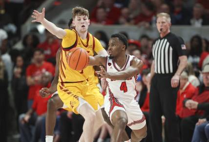 Feb 19, 2024; Houston, Texas, USA; Houston Cougars guard L.J. Cryer (4) passes the ball during the first half against the Iowa State Cyclones at Fertitta Center. Mandatory Credit: Troy Taormina-USA TODAY Sports