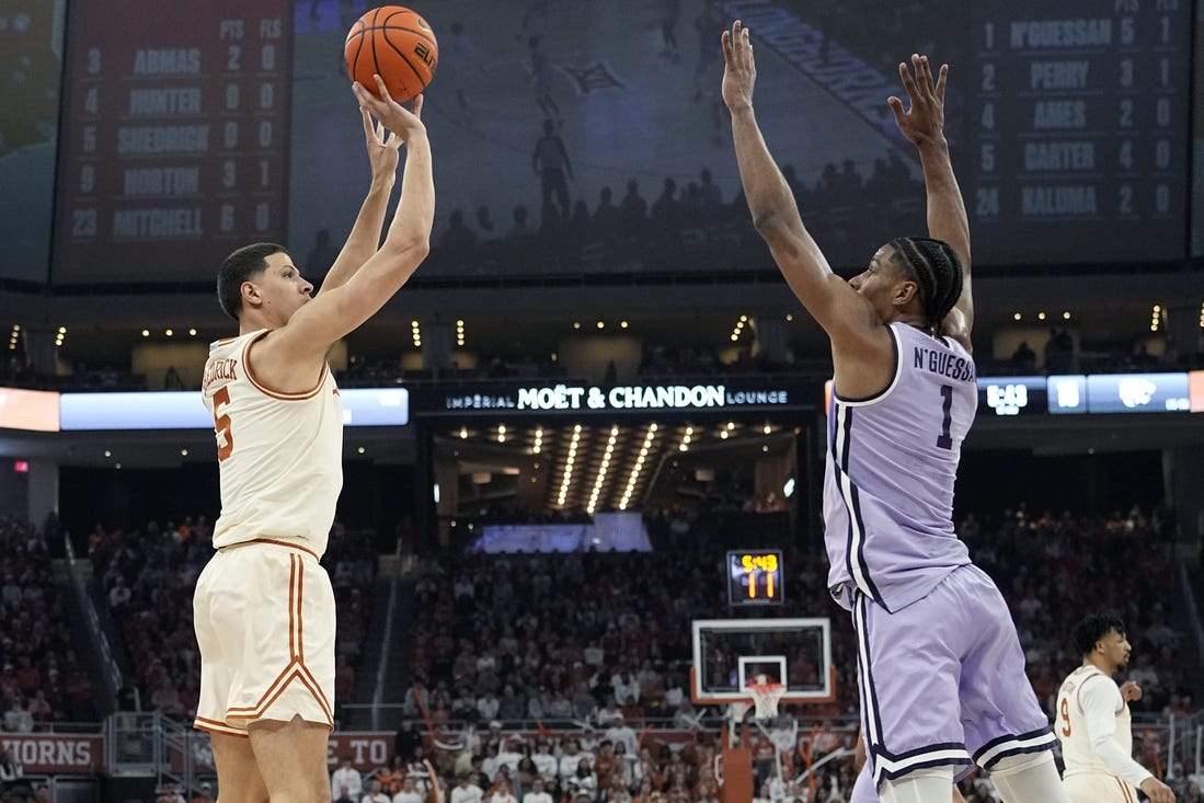 Feb 19, 2024; Austin, Texas, USA; Texas Longhorns forward Kadin Shedrick (5) shoots over Kansas State Wildcats forward David N'Guessan (1) during the first half at Moody Center. Mandatory Credit: Scott Wachter-USA TODAY Sports