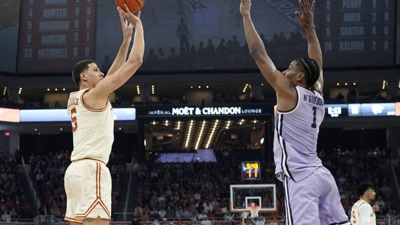 Feb 19, 2024; Austin, Texas, USA; Texas Longhorns forward Kadin Shedrick (5) shoots over Kansas State Wildcats forward David N'Guessan (1) during the first half at Moody Center. Mandatory Credit: Scott Wachter-USA TODAY Sports