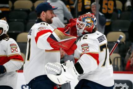 Feb 14, 2024; Pittsburgh, Pennsylvania, USA;  Florida Panthers goaltenders Anthony Stolarz (41) and Sergei Bobrovsky (72) celebrate after defeating the Pittsburgh Penguins at PPG Paints Arena. Mandatory Credit: Charles LeClaire-USA TODAY Sports
