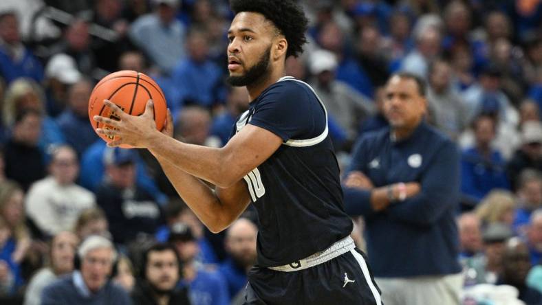 Feb 13, 2024; Omaha, Nebraska, USA;  Georgetown Hoyas guard Jayden Epps (10) passes against the Creighton Bluejays in the first half at CHI Health Center Omaha. Mandatory Credit: Steven Branscombe-USA TODAY Sports