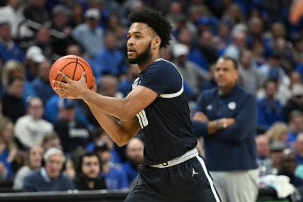 Feb 13, 2024; Omaha, Nebraska, USA;  Georgetown Hoyas guard Jayden Epps (10) passes against the Creighton Bluejays in the first half at CHI Health Center Omaha. Mandatory Credit: Steven Branscombe-USA TODAY Sports