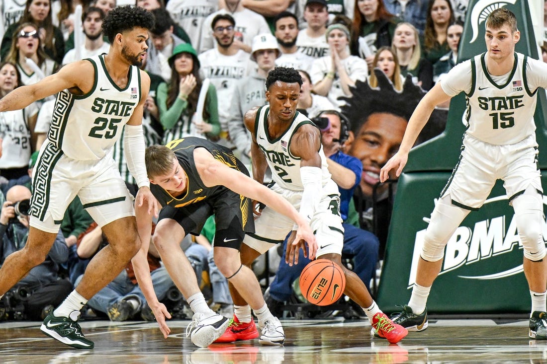 Michigan State's Tyson Walker, right, steals the ball from Iowa's Josh Dix during the first half on Tuesday, Feb. 20, 2024, at the Breslin Center in East Lansing.