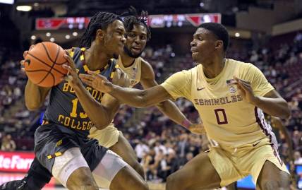 Feb 20, 2024; Tallahassee, Florida, USA; Boston College Eagles guard Donald Hand Jr. (13) is pressured by Florida State Seminoles guard Chandler Jackson (0) during the first half at Donald L. Tucker Center. Mandatory Credit: Melina Myers-USA TODAY Sports