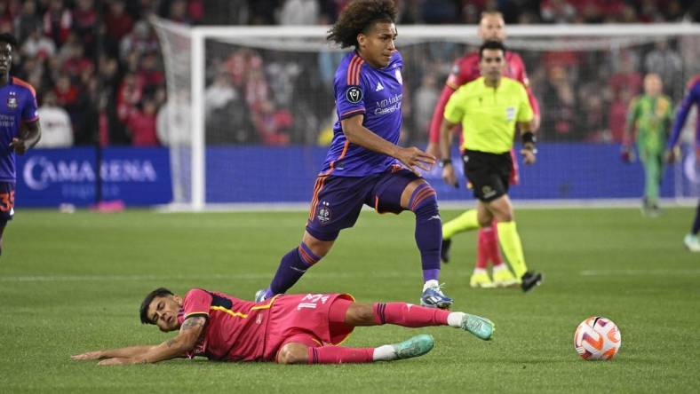 Feb 20, 2024; St. Louis, MO, USA; Houston Dynamo midfielder Adalberto Carrasquilla (20) dribbles past St. Louis City defender Anthony Markanich (13) during the first half of the CONCACAF Champions Cup-Round One at CITYPARK. Mandatory Credit: Joe Puetz-USA TODAY Sports