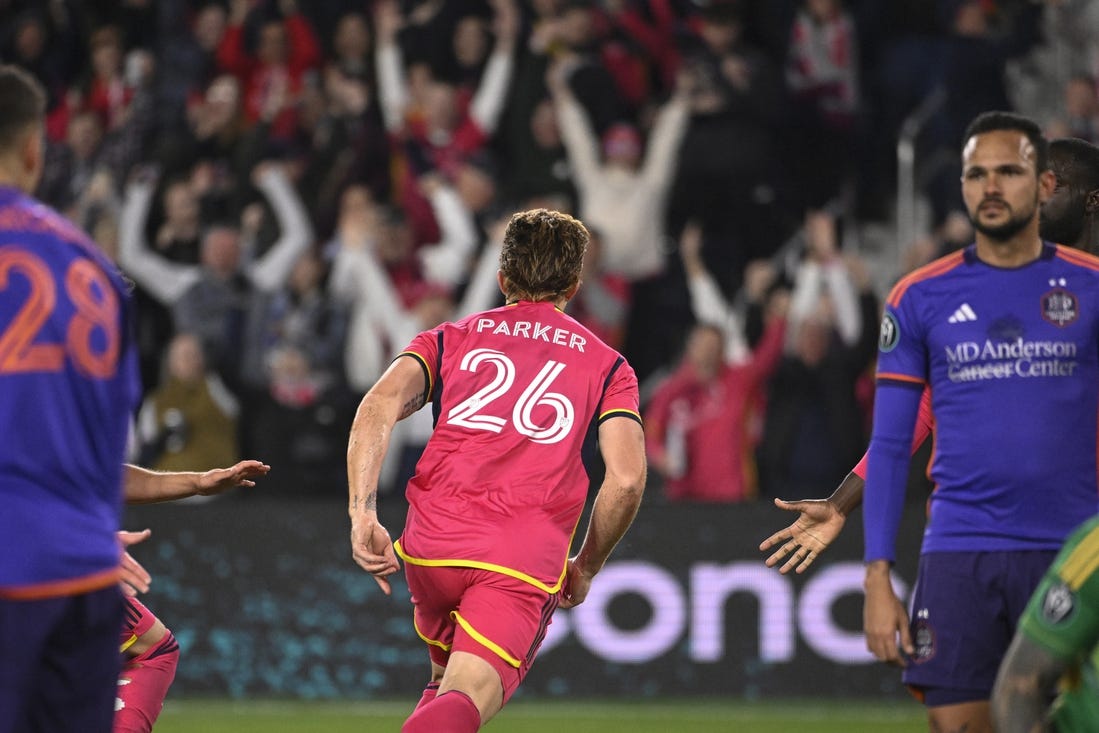 Feb 20, 2024; St. Louis, MO, USA; St. Louis City defender Tim Parker (26) reacts after scoring a goal against the Houston Dynamo during the second half of the CONCACAF Champions Cup-Round One at CITYPARK. Mandatory Credit: Joe Puetz-USA TODAY Sports