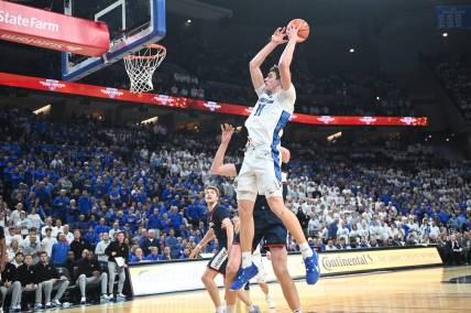 Feb 20, 2024; Omaha, Nebraska, USA; Creighton Bluejays center Ryan Kalkbrenner (11) grabs a pass against the Connecticut Huskies in the second half at CHI Health Center Omaha. Mandatory Credit: Steven Branscombe-USA TODAY Sports