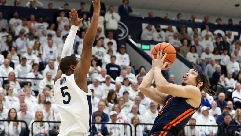 Feb 21, 2024; University Park, Pennsylvania, USA; Illinois Fighting Illini guard Dra Gibbs-Lawhorn (2) drives against Penn State Nittany Lions guard Jameel Brown (5) during the first half at Rec Hall. Mandatory Credit: Matthew O'Haren-USA TODAY Sports