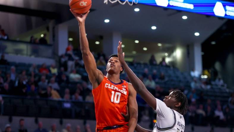 Feb 21, 2024; Atlanta, Georgia, USA; Clemson Tigers forward RJ Godfrey (10) shoots past Georgia Tech Yellow Jackets forward Baye Ndongo (11) in the first half at McCamish Pavilion. Mandatory Credit: Brett Davis-USA TODAY Sports