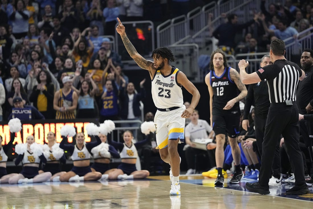 Feb 21, 2024; Milwaukee, Wisconsin, USA;  Marquette Golden Eagles forward David Joplin (23) celebrates after scoring a basket during the first half against the DePaul Blue Demons at Fiserv Forum. Mandatory Credit: Jeff Hanisch-USA TODAY Sports