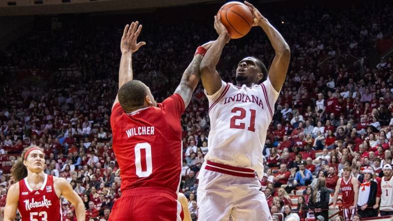 Feb 21, 2024; Bloomington, Indiana, USA; Indiana Hoosiers forward Mackenzie Mgbako (21) shoots the ball while Nebraska Cornhuskers guard C.J. Wilcher (0) defends in the first half at Simon Skjodt Assembly Hall. Mandatory Credit: Trevor Ruszkowski-USA TODAY Sports