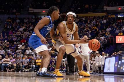 Feb 21, 2024; Baton Rouge, Louisiana, USA; LSU Tigers guard Mike Williams III (2) dribbles against the Kentucky Wildcats  during the first half of the game at Pete Maravich Assembly Center. Mandatory Credit: Stephen Lew-USA TODAY Sports