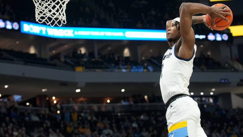 Marquette guard Chase Ross (2) dunks the ball after a steal during the first half of their game against DePaul Wednesday, February 21, 2024 at Fiserv Forum in Milwaukee, Wisconsin.