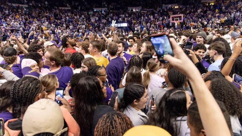 Feb 21, 2024; Baton Rouge, Louisiana, USA; LSU Tigers storm the court after the LSU Tigers defeat the Kentucky Wildcats after the game at Pete Maravich Assembly Center. Mandatory Credit: Stephen Lew-USA TODAY Sports