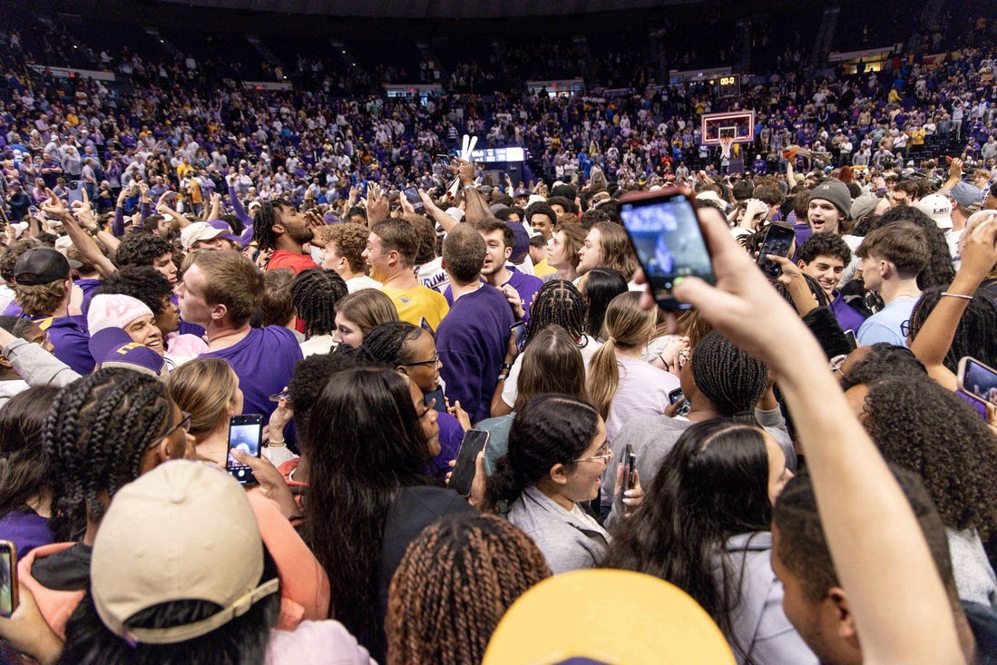 Feb 21, 2024; Baton Rouge, Louisiana, USA; LSU Tigers storm the court after the LSU Tigers defeat the Kentucky Wildcats after the game at Pete Maravich Assembly Center. Mandatory Credit: Stephen Lew-USA TODAY Sports