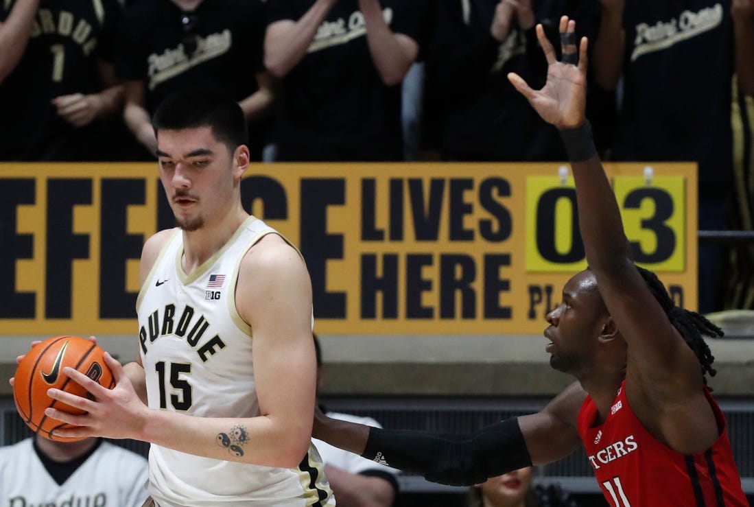 Purdue Boilermakers center Zach Edey (15) is defended by Rutgers Scarlet Knights center Clifford Omoruyi (11) during the NCAA men   s basketball game, Thursday, Feb. 22, 2024, at Mackey Arena in West Lafayette, Ind.