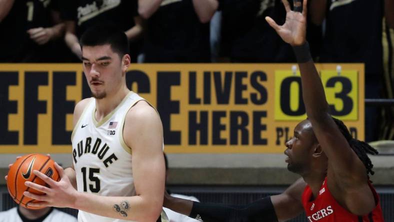 Purdue Boilermakers center Zach Edey (15) is defended by Rutgers Scarlet Knights center Clifford Omoruyi (11) during the NCAA men   s basketball game, Thursday, Feb. 22, 2024, at Mackey Arena in West Lafayette, Ind.