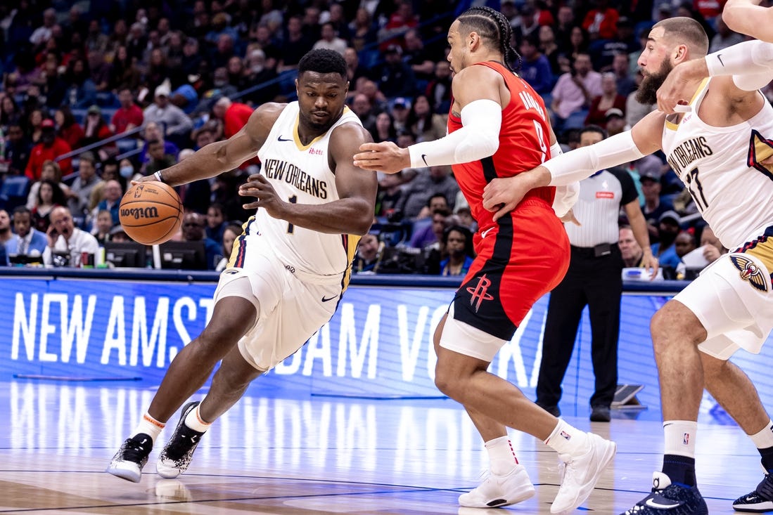 Feb 22, 2024; New Orleans, Louisiana, USA;  New Orleans Pelicans forward Zion Williamson (1) dribbles against Houston Rockets forward Dillon Brooks (9) during the first half at Smoothie King Center. Mandatory Credit: Stephen Lew-USA TODAY Sports
