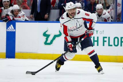 Feb 22, 2024; Tampa, Florida, USA;  Washington Capitals left wing Alex Ovechkin (8) shoots the puck against the Tampa Bay Lightning in the second period at Amalie Arena. Mandatory Credit: Nathan Ray Seebeck-USA TODAY Sports