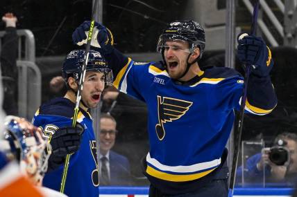 Feb 22, 2024; St. Louis, Missouri, USA;  St. Louis Blues left wing Pavel Buchnevich (89) celebrates with center Jordan Kyrou (25) after scoring his second goal of the game against New York Islanders goaltender Semyon Varlamov (40) during the second period at Enterprise Center. Mandatory Credit: Jeff Curry-USA TODAY Sports