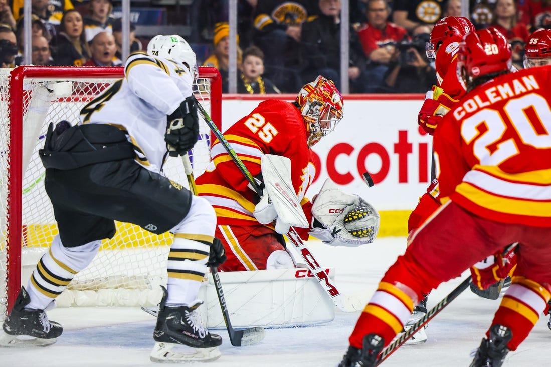 Feb 22, 2024; Calgary, Alberta, CAN; Calgary Flames goaltender Jacob Markstrom (25) makes a save against the Boston Bruins during the first period at Scotiabank Saddledome. Mandatory Credit: Sergei Belski-USA TODAY Sports