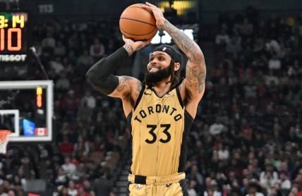 Feb 22, 2024; Toronto, Ontario, CAN;  Toronto Raptors guard Gary Trent Jr. (33) shoots the ball against the Brooklyn Nets in the first half at Scotiabank Arena. Mandatory Credit: Dan Hamilton-USA TODAY Sports