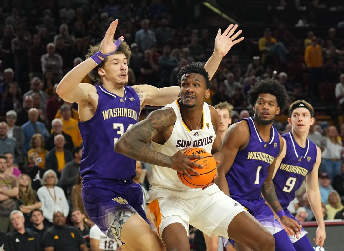 Feb 22, 2024; Tempe, Arizona, USA; Arizona State Sun Devils center Shawn Phillips Jr. (9) works under the basket against Washington Huskies center Braxton Meah (34) during the second half at Desert Financial Arena. Mandatory Credit: Joe Camporeale-USA TODAY Sports