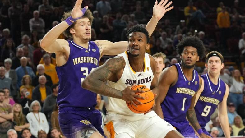 Feb 22, 2024; Tempe, Arizona, USA; Arizona State Sun Devils center Shawn Phillips Jr. (9) works under the basket against Washington Huskies center Braxton Meah (34) during the second half at Desert Financial Arena. Mandatory Credit: Joe Camporeale-USA TODAY Sports