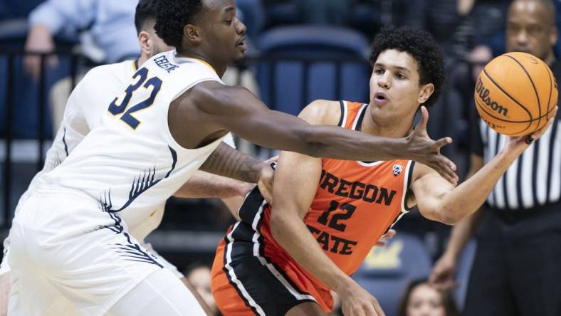 February 22, 2024; Berkeley, California, USA; Oregon State Beavers forward Michael Rataj (12) passes the basketball against California Golden Bears guard Jalen Celestine (32) during the first half at Haas Pavilion. Mandatory Credit: Kyle Terada-USA TODAY Sports