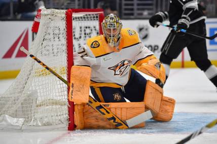 Feb 22, 2024; Los Angeles, California, USA; Nashville Predators goaltender Juuse Saros (74) defends the goal against the Los Angeles Kings during the second period at Crypto.com Arena. Mandatory Credit: Gary A. Vasquez-USA TODAY Sports