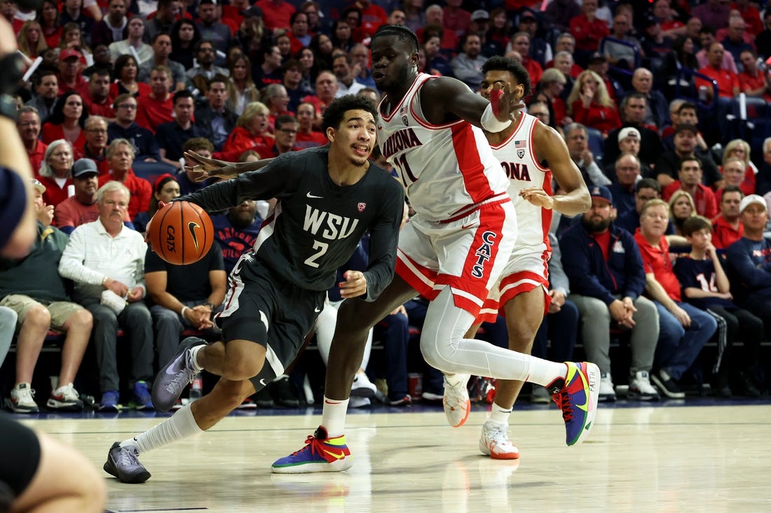 Feb 22, 2024; Tucson, Arizona, USA; Washington State Cougars guard Myles Rice (2) drives to the net against Arizona Wildcats center Oumar Ballo (11) during the first half at McKale Center. Mandatory Credit: Zachary BonDurant-USA TODAY Sports