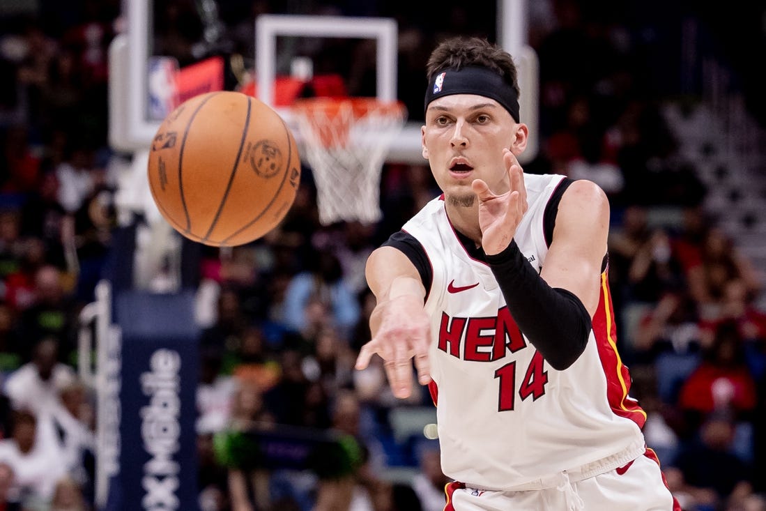 Feb 23, 2024; New Orleans, Louisiana, USA;  Miami Heat guard Tyler Herro (14) passes the ball against the New Orleans Pelicans during the first half at Smoothie King Center. Mandatory Credit: Stephen Lew-USA TODAY Sports