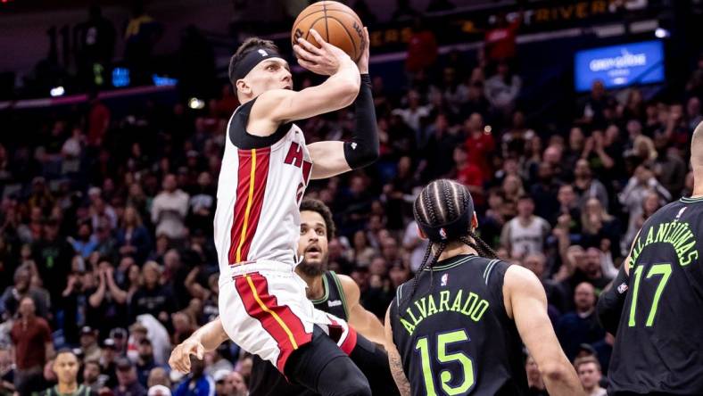 Feb 23, 2024; New Orleans, Louisiana, USA;  Miami Heat guard Tyler Herro (14) shoots a jump shot against the New Orleans Pelicans during the first half at Smoothie King Center. Mandatory Credit: Stephen Lew-USA TODAY Sports