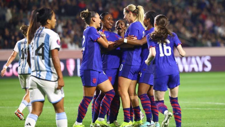 Feb 23, 2024; Carson, California, USA; United States midfielder Jaedyn Shaw (8) celebrates with teammates after scoring a goal against Argentina during the first half at Dignity Health Sports Park. Mandatory Credit: Jessica Alcheh-USA TODAY Sports