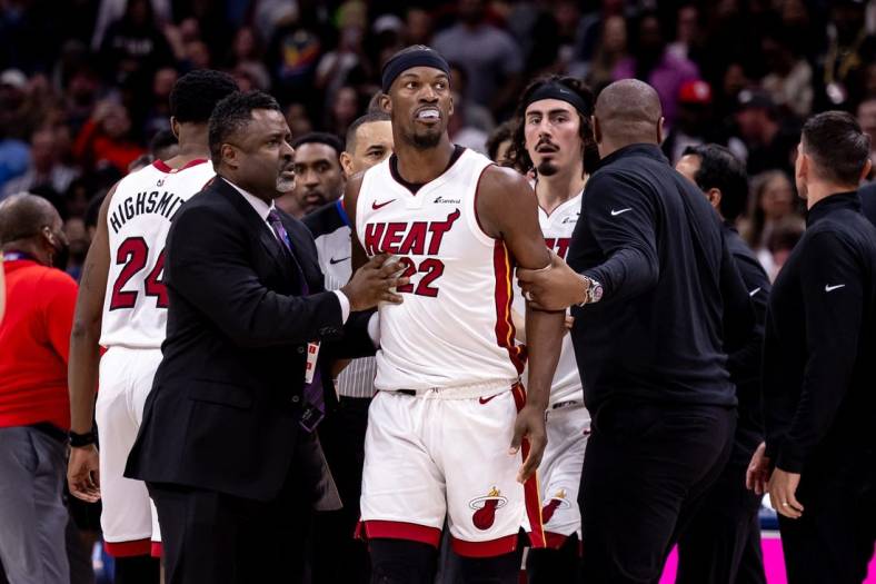 Feb 23, 2024; New Orleans, Louisiana, USA;  Miami Heat forward Jimmy Butler (22) and New Orleans Pelicans forward Naji Marshall (8) and guard Jose Alvarado (15) are ejected after a melee due to a play during the second half at Smoothie King Center. Mandatory Credit: Stephen Lew-USA TODAY Sports