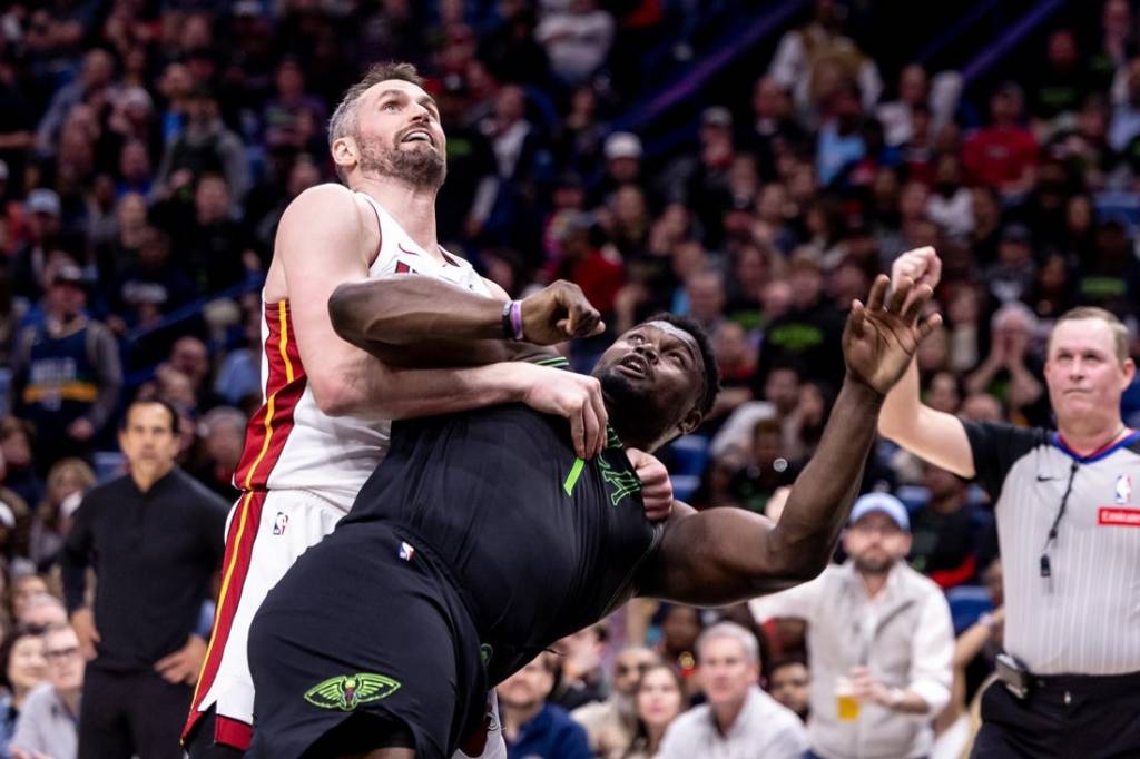 Feb 23, 2024; New Orleans, Louisiana, USA;  Miami Heat forward Kevin Love (42) fouls New Orleans Pelicans forward Zion Williamson (1) which starts a melee causing three players to be ejected during the second half at Smoothie King Center. Mandatory Credit: Stephen Lew-USA TODAY Sports