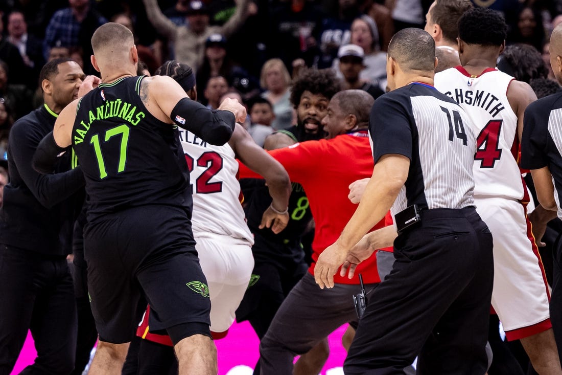 Feb 23, 2024; New Orleans, Louisiana, USA;  Miami Heat forward Jimmy Butler (22) and New Orleans Pelicans forward Naji Marshall (8) and guard Jose Alvarado (15) are ejected after a melee due to a play during the second half at Smoothie King Center. Mandatory Credit: Stephen Lew-USA TODAY Sports