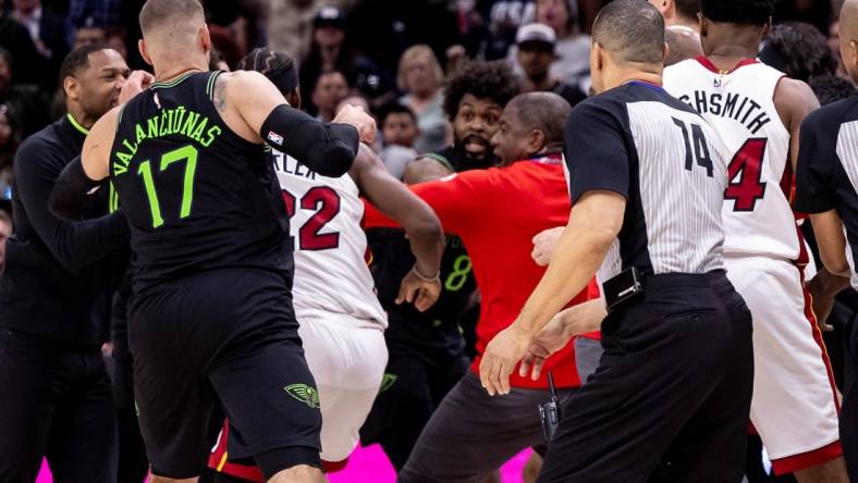 Feb 23, 2024; New Orleans, Louisiana, USA;  Miami Heat forward Jimmy Butler (22) and New Orleans Pelicans forward Naji Marshall (8) and guard Jose Alvarado (15) are ejected after a melee due to a play during the second half at Smoothie King Center. Mandatory Credit: Stephen Lew-USA TODAY Sports