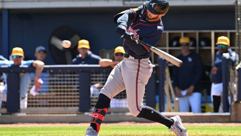 Feb 24, 2024; Port Charlotte, Florida, USA; Atlanta Braves right fielder Forrest Wall (73) hits a RBI single in the second inning of a spring training game against theTampa Bay Rays at Charlotte Sports Park. Mandatory Credit: Jonathan Dyer-USA TODAY Sports