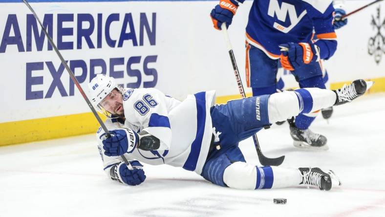 Feb 24, 2024; Elmont, New York, USA;  Tampa Bay Lightning right wing Nikita Kucherov (86) falls on the ice after a collision in the first period against the New York Islanders at UBS Arena. Mandatory Credit: Wendell Cruz-USA TODAY Sports
