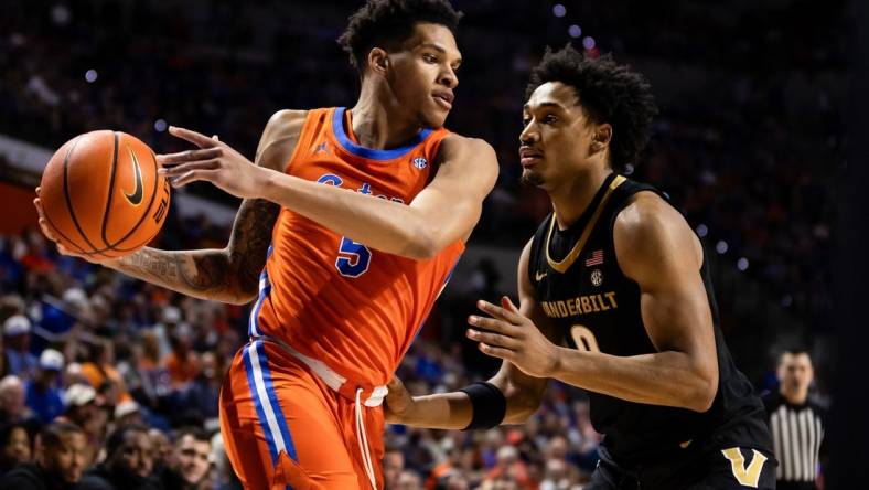 Feb 24, 2024; Gainesville, Florida, USA; Florida Gators guard Will Richard (5) looks to drive at Vanderbilt Commodores guard Tyrin Lawrence (0) during the second half at Exactech Arena at the Stephen C. O'Connell Center. Mandatory Credit: Matt Pendleton-USA TODAY Sports