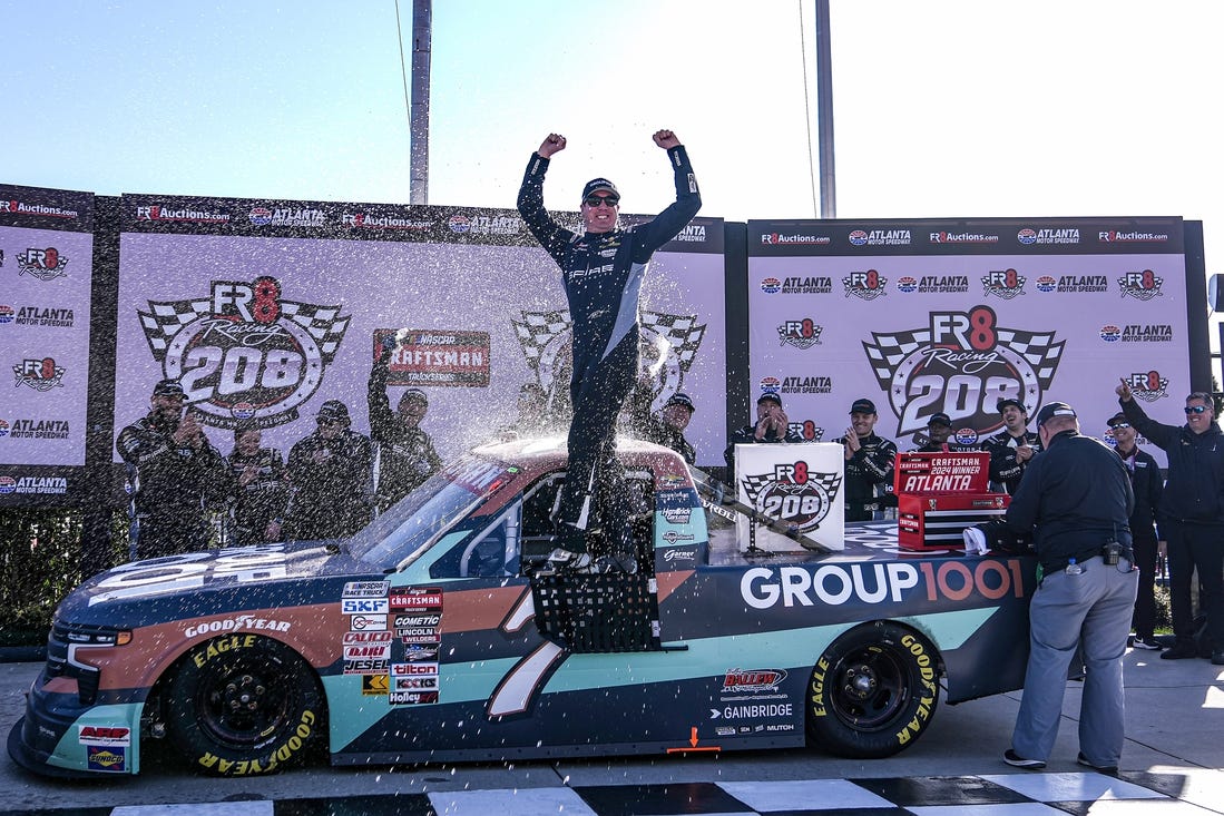 Feb 24, 2024; Hampton, Georgia, USA; NASCAR Craftsman Truck Series Driver Kyle Busch celebrates in victory lane after winning the Fr8 208 at Atlanta Motor Speedway. Mandatory Credit: David Yeazell-USA TODAY Sports