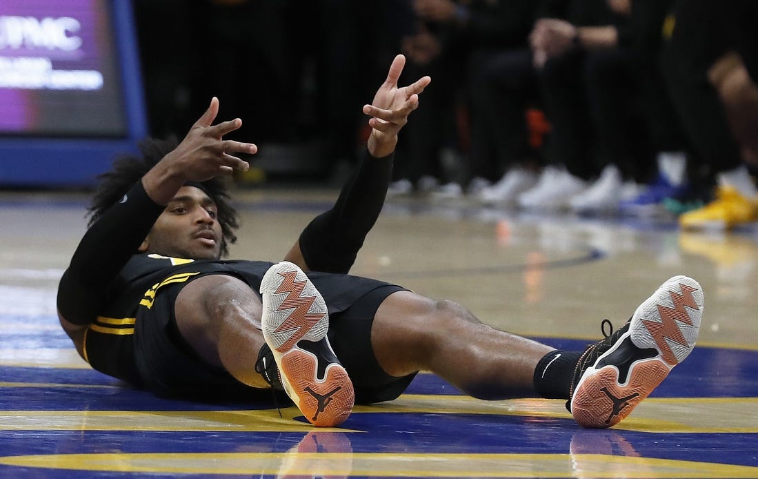 Feb 24, 2024; Pittsburgh, Pennsylvania, USA;  Pittsburgh Panthers forward Blake Hinson (2) reacts after making a three point basket despite being knocked to the court by the Virginia Tech Hokies during the first half at the Petersen Events Center. Mandatory Credit: Charles LeClaire-USA TODAY Sports