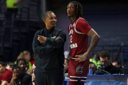 Feb 24, 2024; Oxford, Mississippi, USA; South Carolina Gamecocks head coach Lamont Paris (left) talks with guard Zachary Davis (12) during the second half against the Mississippi Rebels at The Sandy and John Black Pavilion at Ole Miss. Mandatory Credit: Petre Thomas-USA TODAY Sports