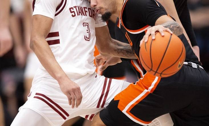 Feb 24, 2024; Stanford, California, USA; Oregon State Beavers guard Jordan Pope (right) collides with Stanford Cardinal guard Kanaan Carlyle (3) during the first half at Maples Pavilion. Mandatory Credit: D. Ross Cameron-USA TODAY Sports