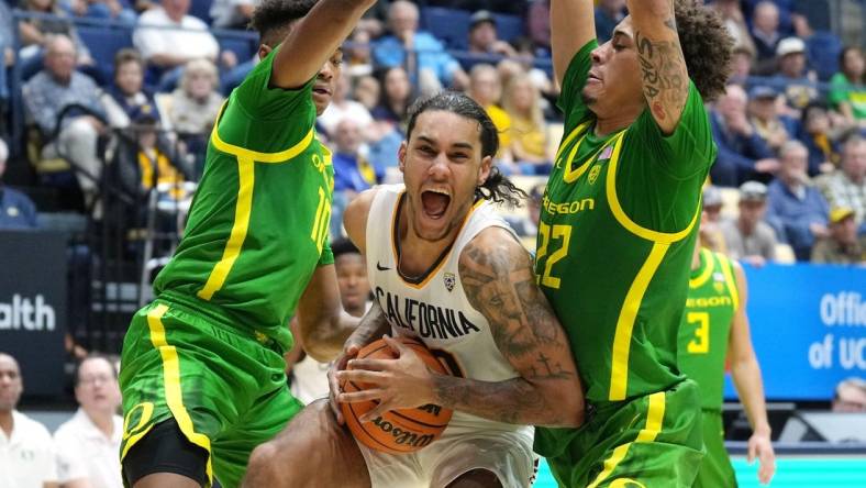 Feb 24, 2024; Berkeley, California, USA; California Golden Bears guard Jaylon Tyson (center) drives against Oregon Ducks forward Kwame Evans Jr. (10) and guard Jadrian Tracey (22) during the first half at Haas Pavilion. Mandatory Credit: Darren Yamashita-USA TODAY Sports