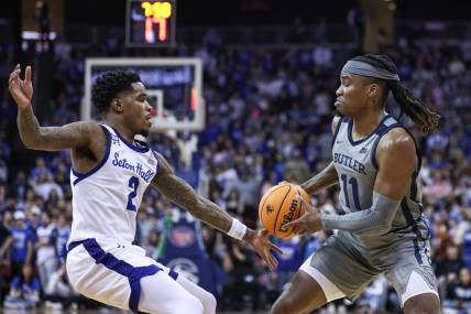Feb 24, 2024; Newark, New Jersey, USA; Butler Bulldogs guard Jahmyl Telfort (11) looks to pass was Seton Hall Pirates guard Al-Amir Dawes (2) defends during the first half at Prudential Center. Mandatory Credit: Vincent Carchietta-USA TODAY Sports
