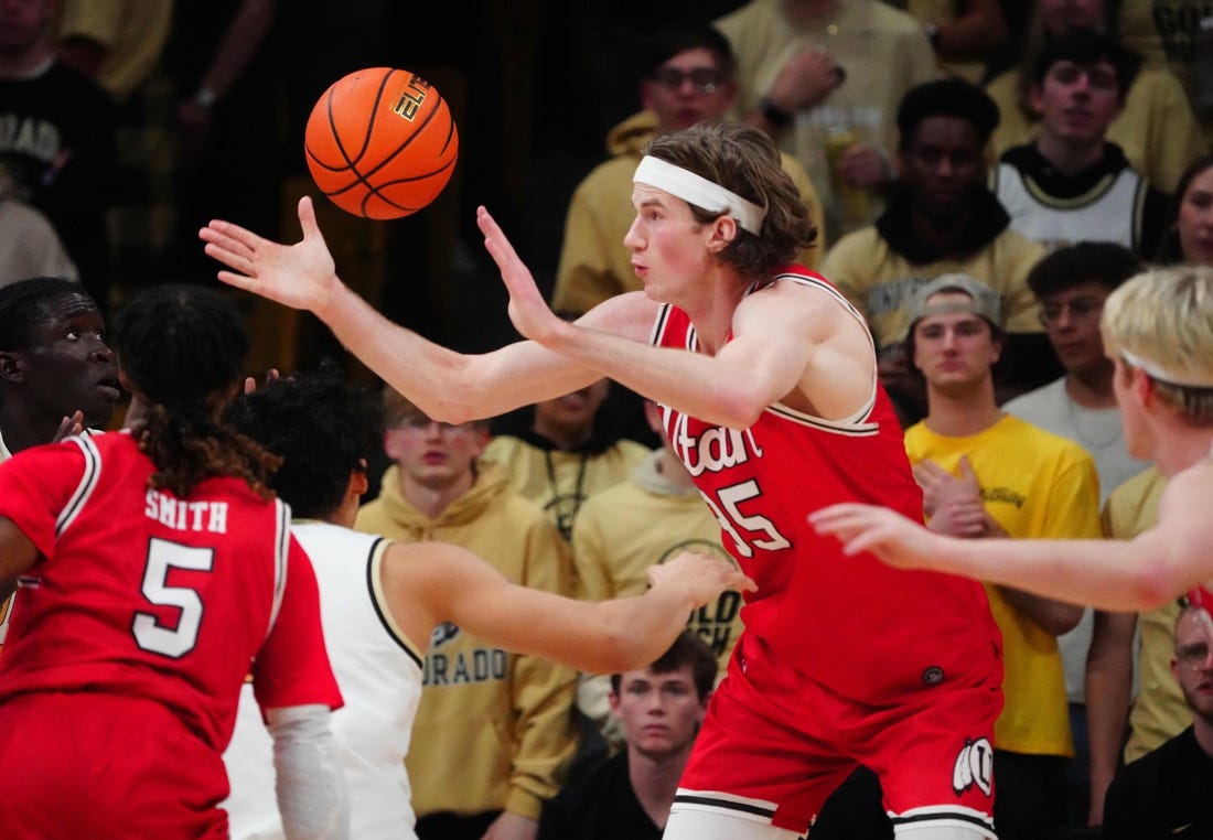 Feb 24, 2024; Boulder, Colorado, USA; Utah Utes center Branden Carlson (35) reaches for a loose ball in the first half against the Colorado Buffaloes at the CU Events Center. Mandatory Credit: Ron Chenoy-USA TODAY Sports